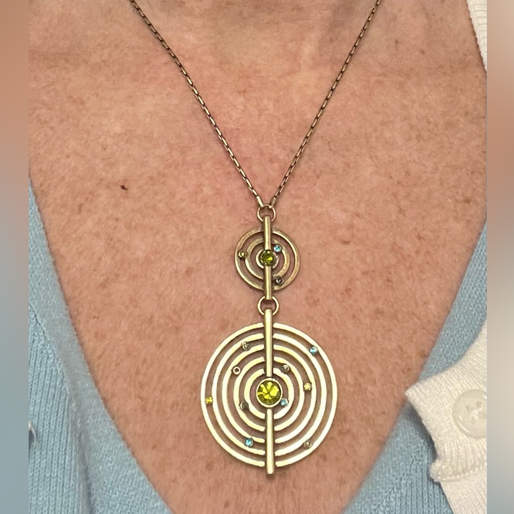 Vintage Catherine Bohm gold tone coiled circle necklace scattered rhinestones.